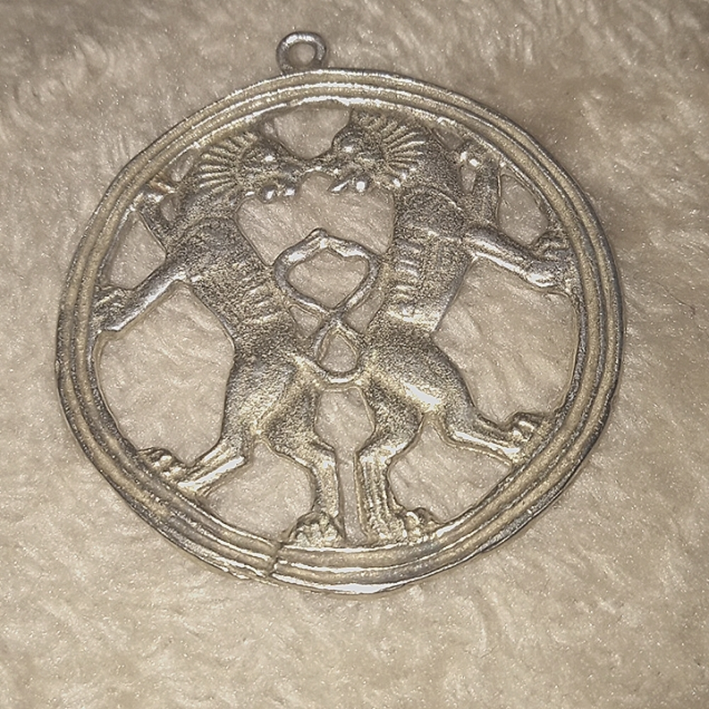Prince of Persia pendant back-to-back lions, Iran, 6th  4th century BCE, silver